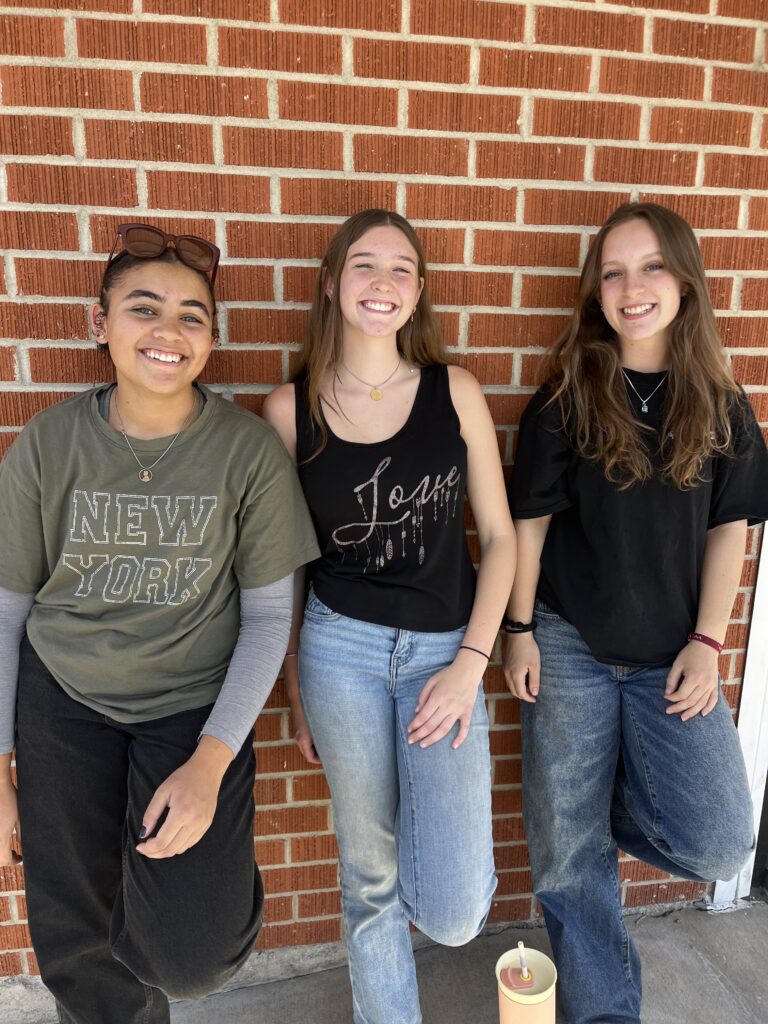 Three Pathways Christian Academy students smiling outside the school building in Boise, Idaho