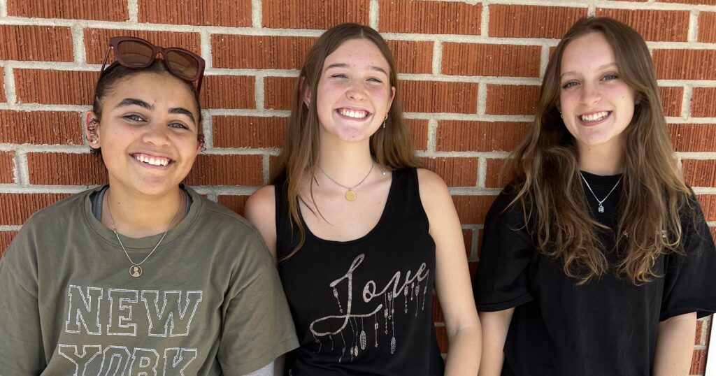 Three Pathways Christian Academy students smiling outside their Boise, Idaho school